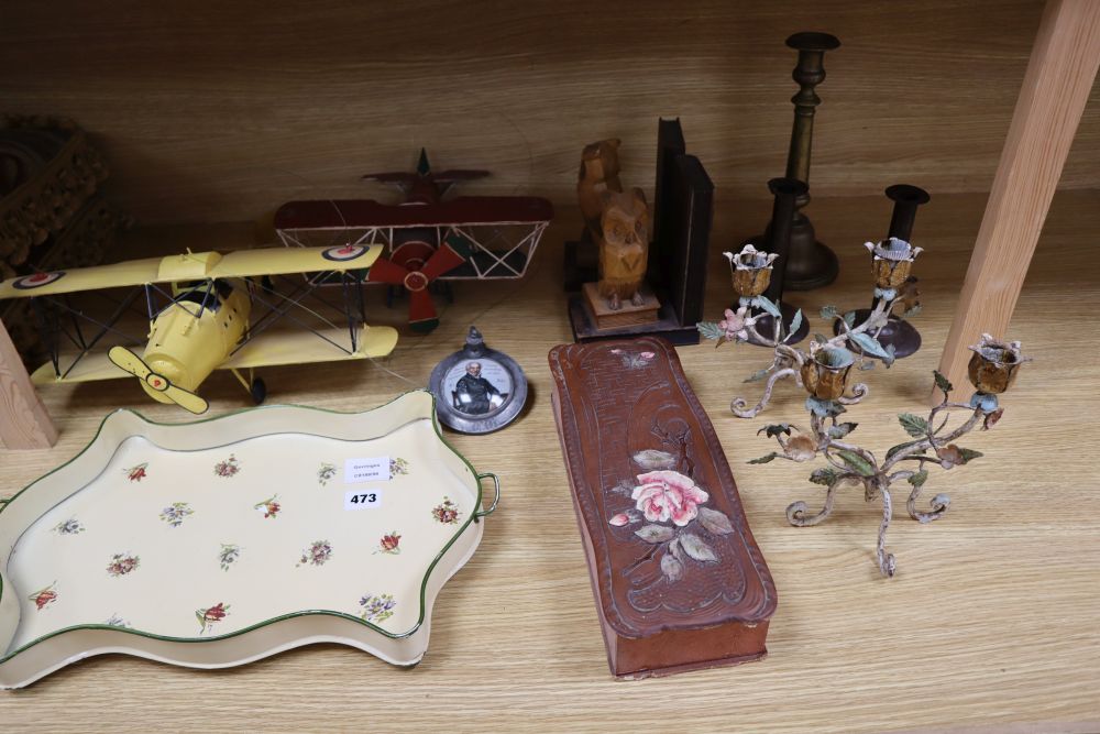 A pair of painted wrought iron candelabra, height 28cm., a pair of tole ejector candlesticks, two bi-plane models, a tankard cover with